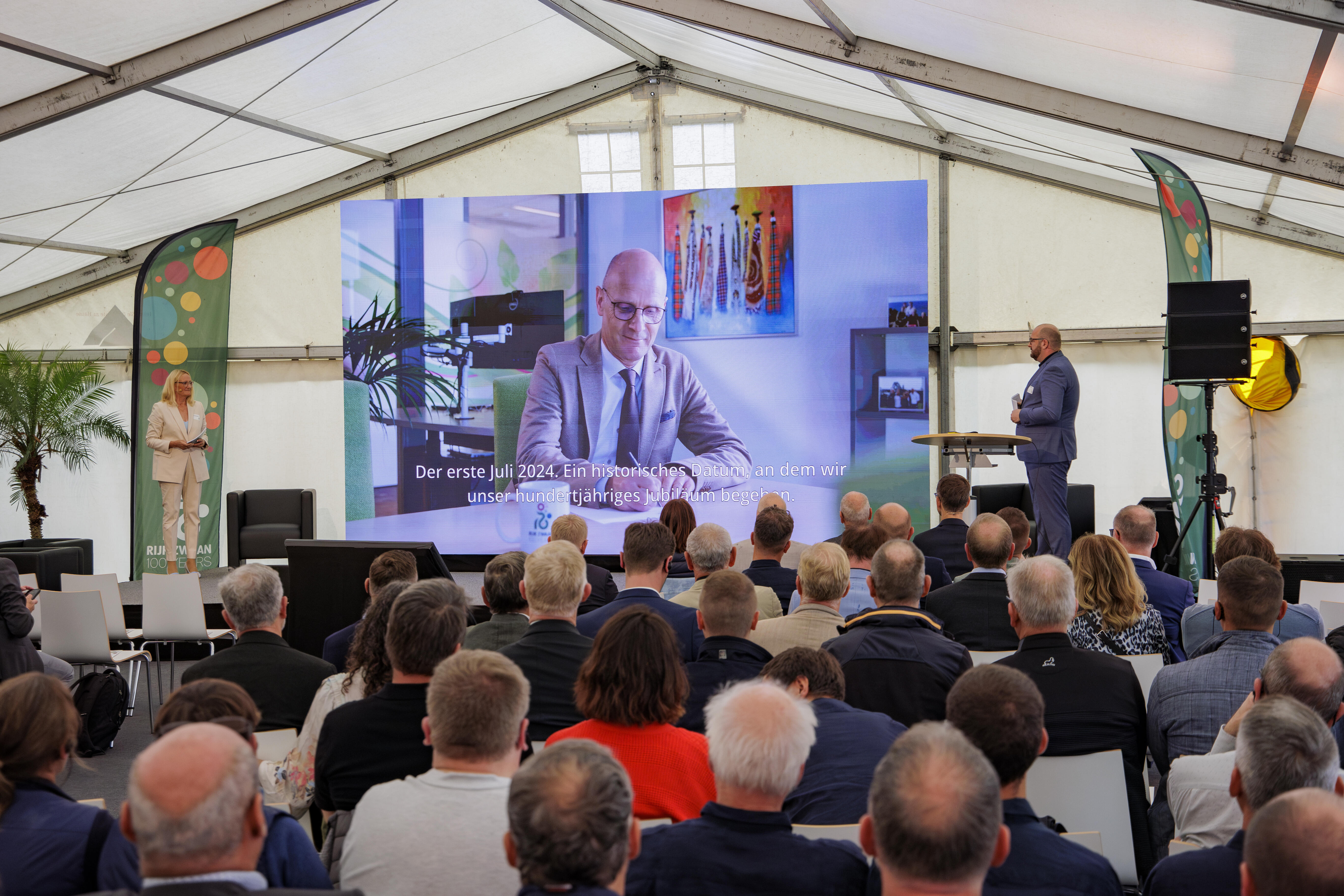Guests in the marquee follow the panel discussion at Rijk Zwaan's 100th anniversary celebration